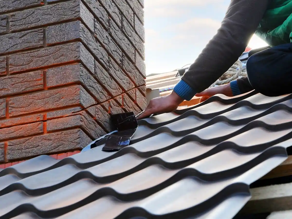 Leak repair at the chimney flashing