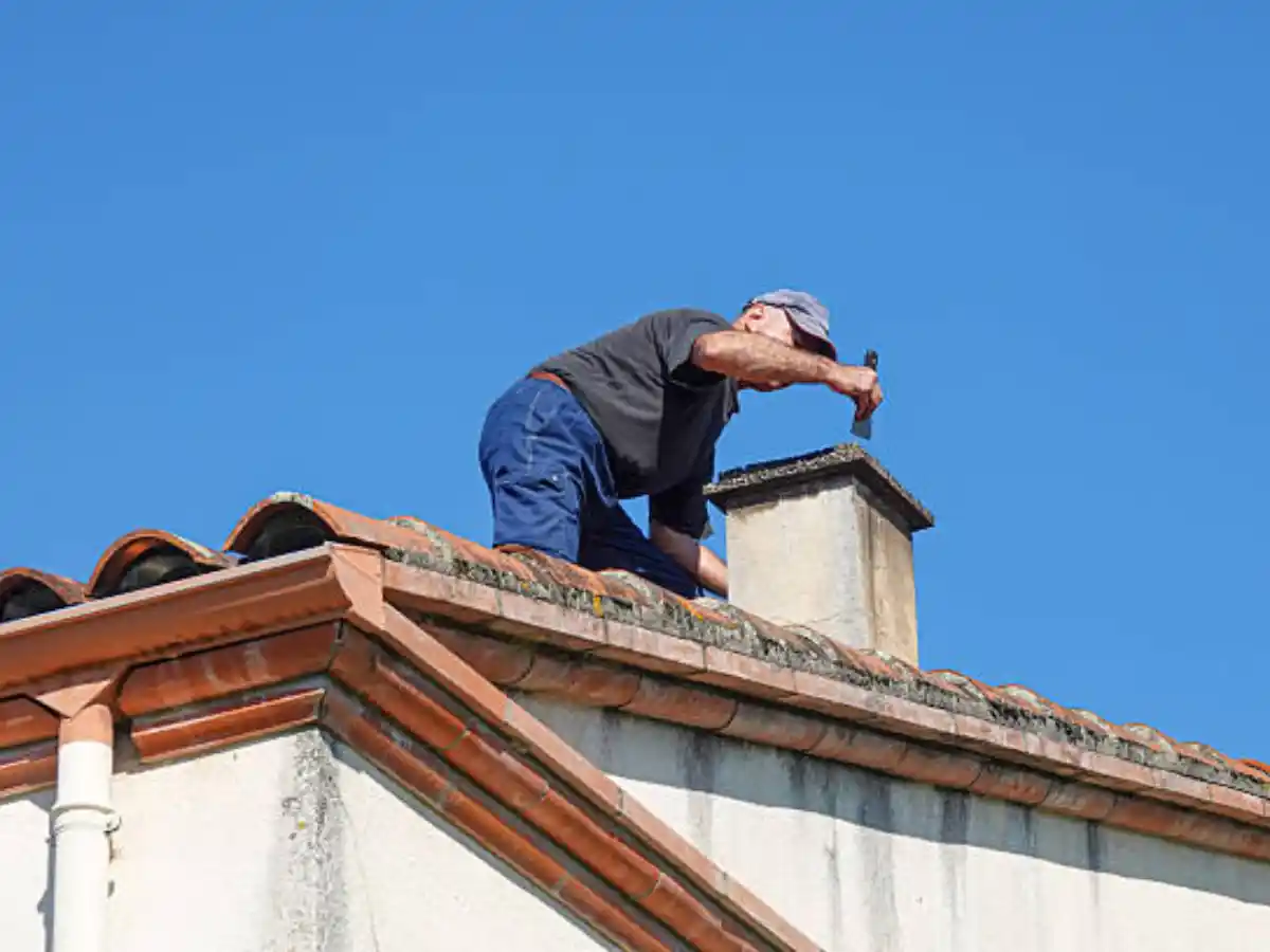 Clearing soot from a chimney flue