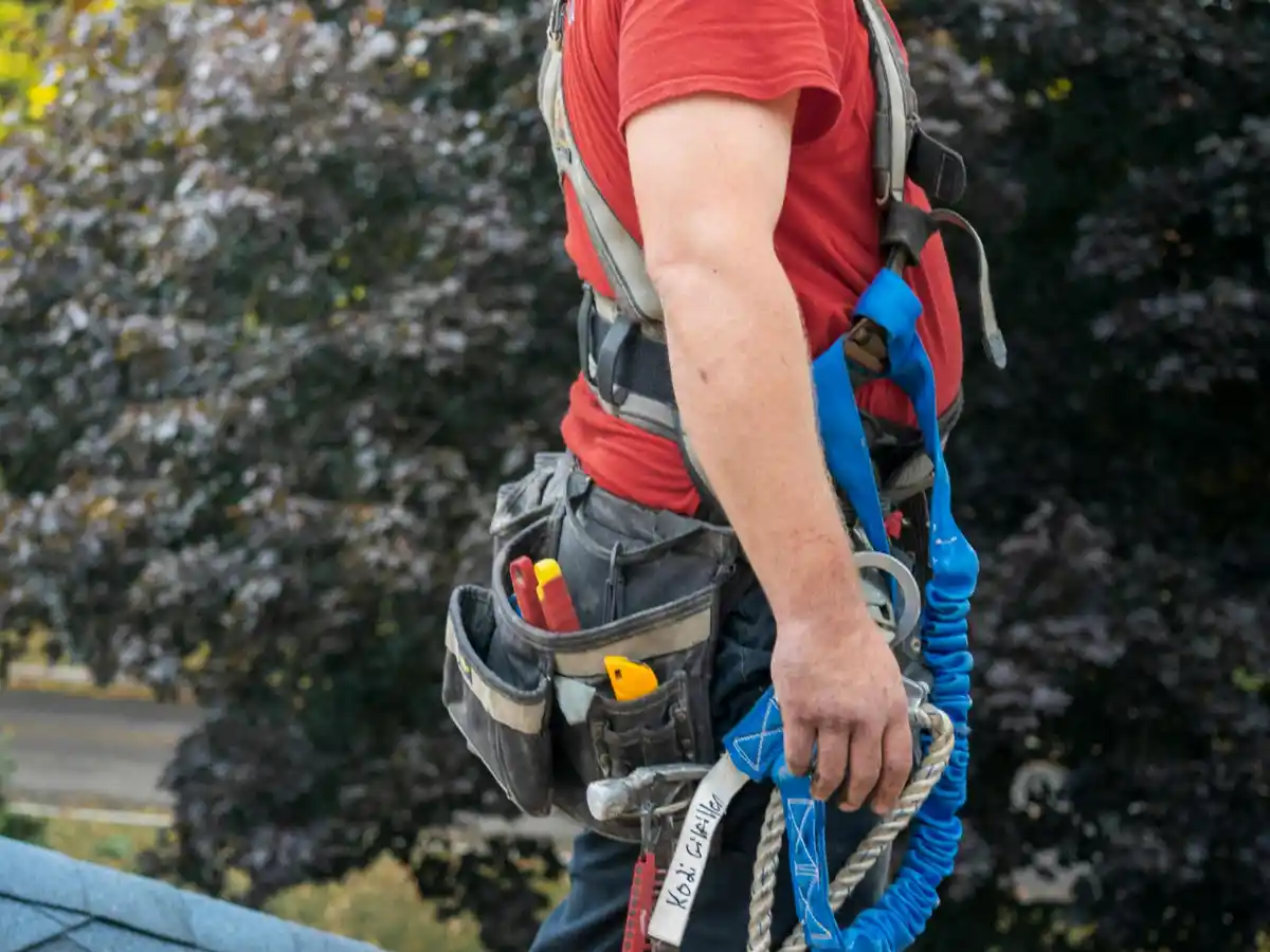 Chimney technician with tool belt