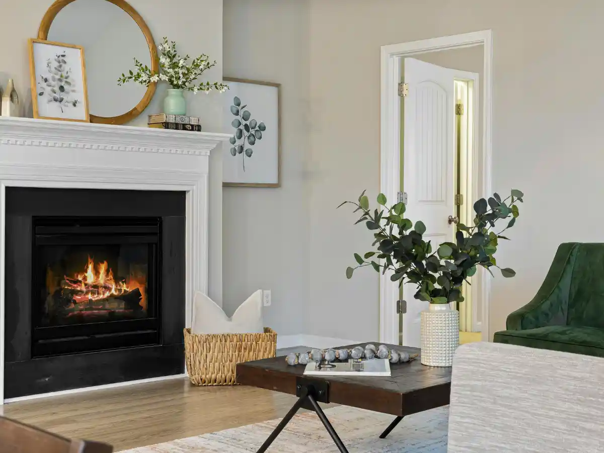 Living room fireplace with a fire lit