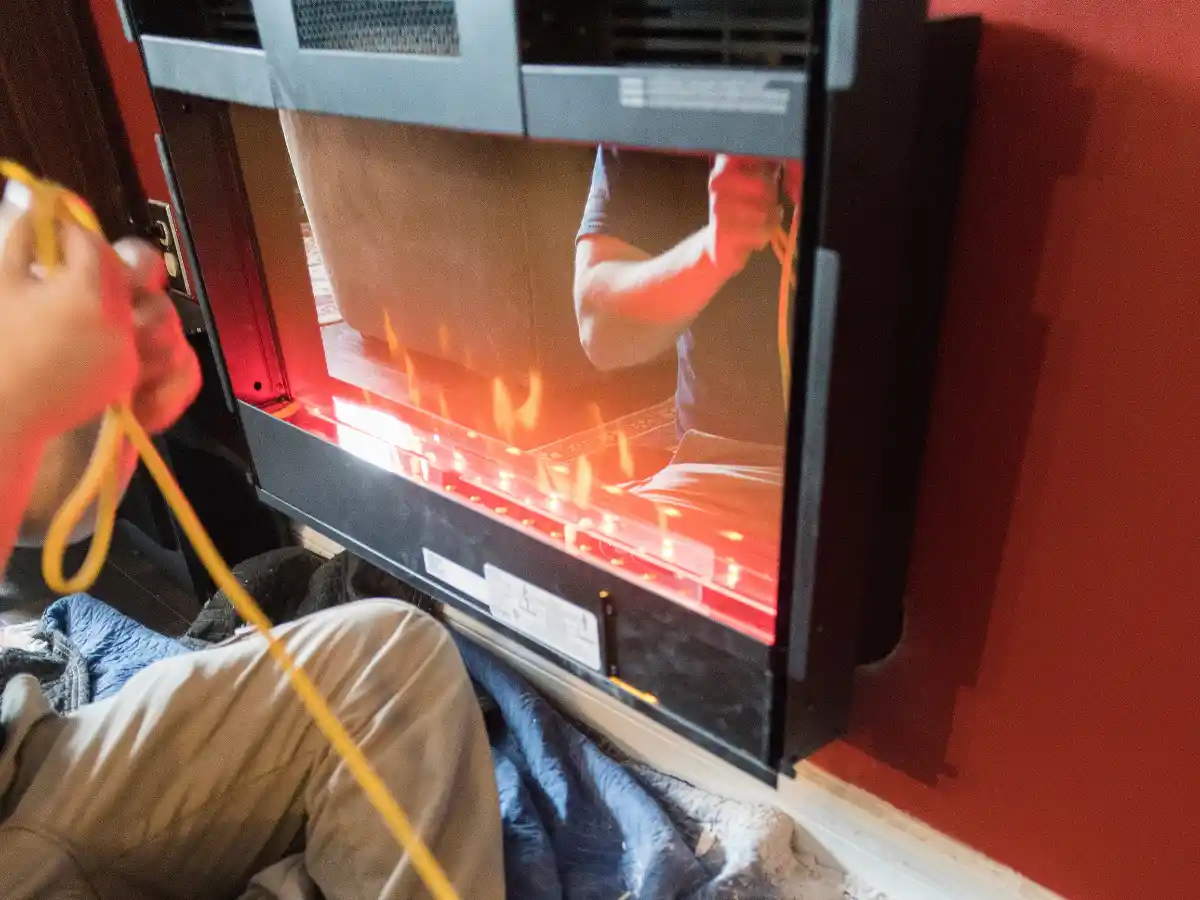 Wood stove being cleaned out